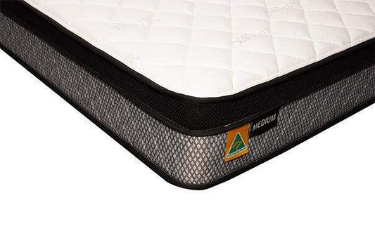Corner view of a medium firmness mattress with quilted top and Australian made label