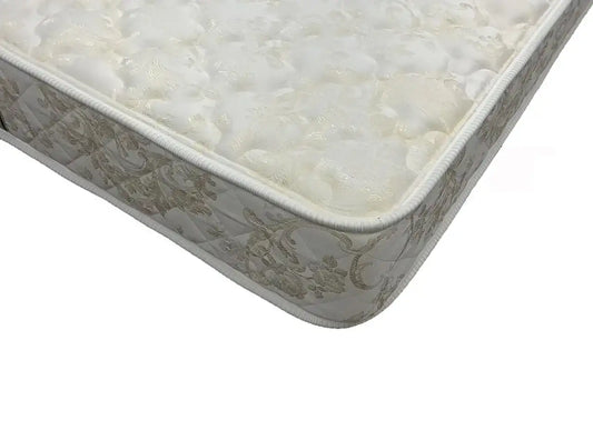 Ultra firm mattress corner with floral patterned fabric and quilted edge
