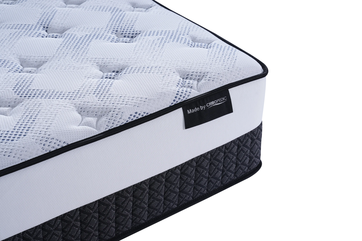 Close-up of a modern Australian mattress with textured top and label, showing quilted fabric design.