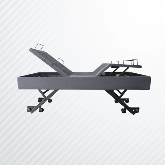 Adjustable electric bed base with grey fabric and casters on light background