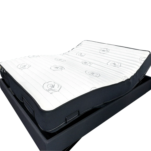 Adjustable bed base with a white, contouring mattress suitable for bedroom comfort