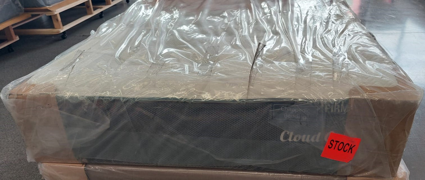 Factory-direct new mattress wrapped in plastic packaging, labeled firm and in stock