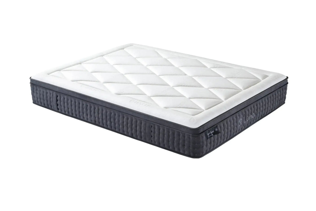 Modern hybrid mattress with quilted white top and dark sides, bedroom furniture product