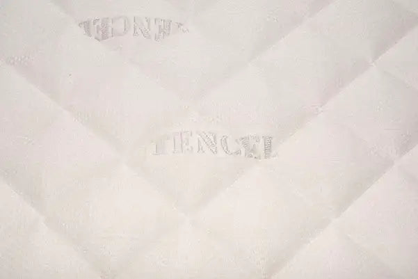 Close-up of a Tencel fabric mattress surface with quilted diamond pattern.