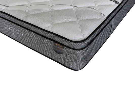 Close-up of a premium pillow-top mattress with quilted surface and reinforced corner support