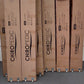 Packaged mattress bases in boxes labeled Chiropedic on wheels, stacked indoors