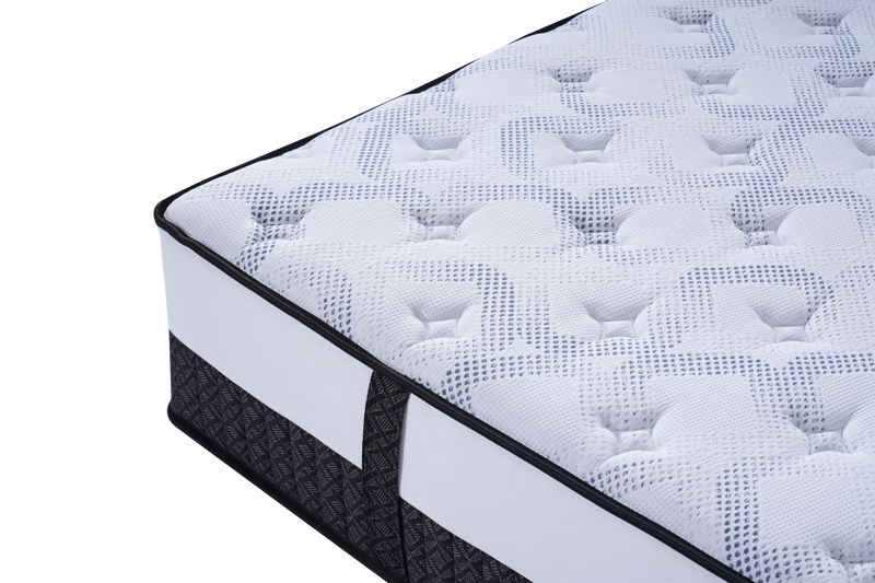 Close-up of a modern mattress with textured white and grey quilted surface and black trim