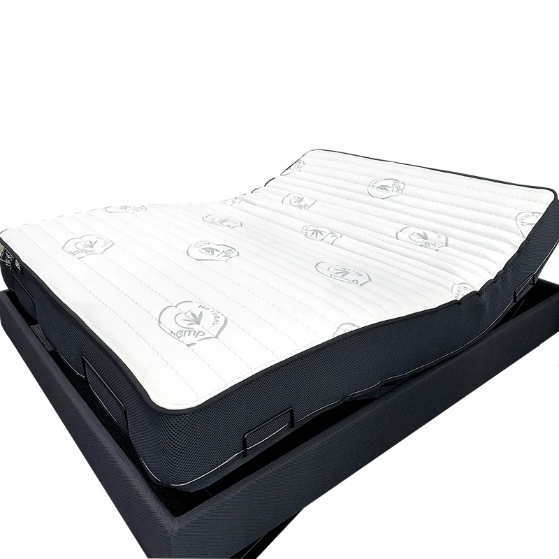 Adjustable bed base with a white, contouring mattress suitable for bedroom comfort