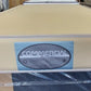 Beige commercial deluxe mattress with label in showroom, wrapped mattresses in background