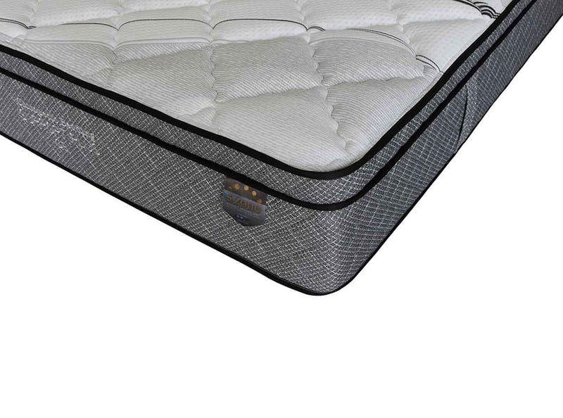 Close-up of a gel-infused, quilted mattress corner with grey side panel and stitched detailing