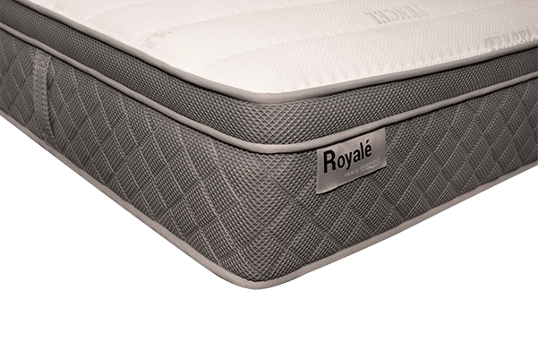 Close-up of a Royale mattress corner with quilted grey side and white top